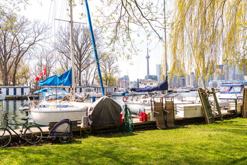 Sail boats at morring in spring, with a city skyline in the background.  Shot in Toronto in early May. © Michael Connor Photo