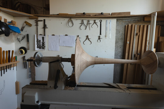 Various woodworking hand tools and manufacturing equipment in workshop, copy space