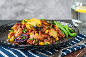 Corned beef, sweetcorn and potato hash with green beans - obrazy, fototapety, plakaty