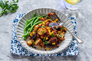 Corned beef, sweetcorn and potato hash with green beans - obrazy, fototapety, plakaty