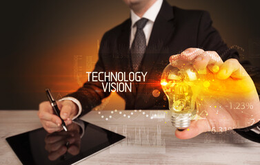 Businessman holding a lightbulb concept