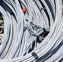 background of skeins of discarded copper electrical cable in the recycling facility