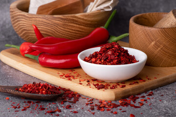 Hot chili pepper in a bowl close-up. Red pepper pods. Hot spice.