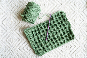 Green crochet craft project in progress