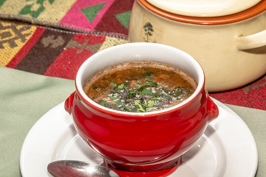 Stewed Cranberry Beans Or Borlotti In Tomato Sauce With Herbs Close-up In A Bowl On The Table. Horizontal Top View From Above