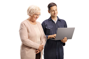 Male worker with a laptop computer showing to a casual elderly woman
