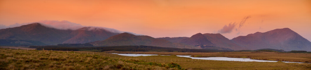 Beautiful sunset view of Connemara region in Ireland. Scenic Irish countryside landscape with...