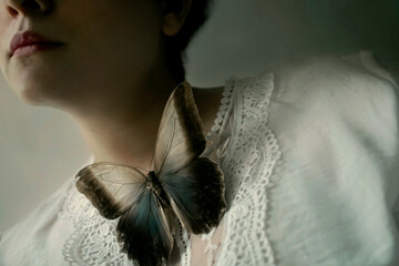 Women with a butterfly in her neck