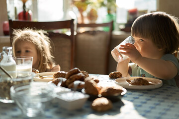 Kids eating healthy goodies at sun-drenched room