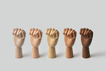Various wooden mannequin hands clenched into fists