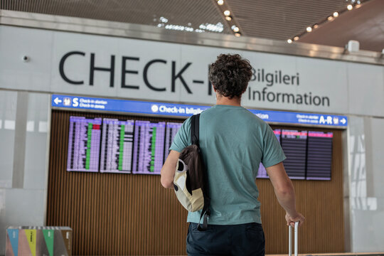 Istanbul airport, passenger looking at the screen, departure terminal