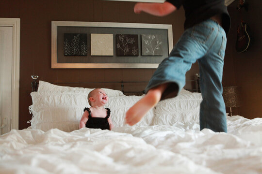 Boy Jumping on Bed 