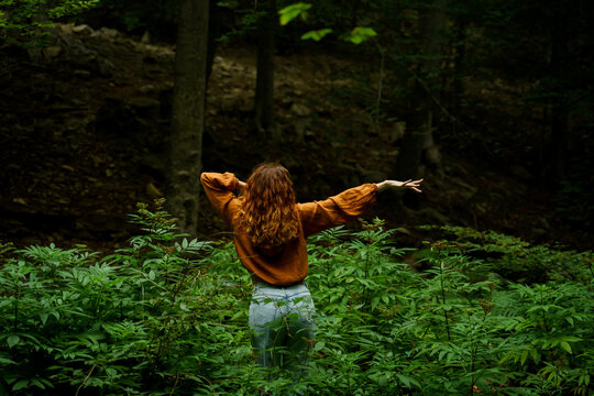 Woman Dancing In The Middle Of Lush Forest