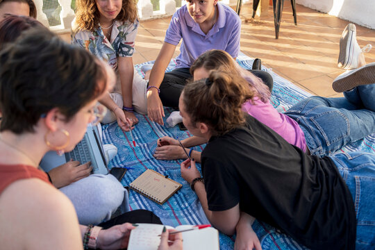 Diverse group of friends planning trip outdoor