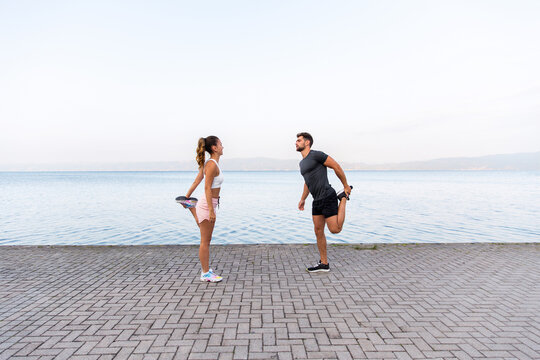 Couple Stretching Before Their Workout