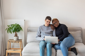 banking online, couple with laptop computer at home