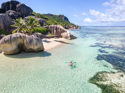 beach travel destination, kayak on tropical beach in Seychelles
