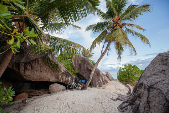 bicycle on sand footpath of tropical beach in Seychelles
