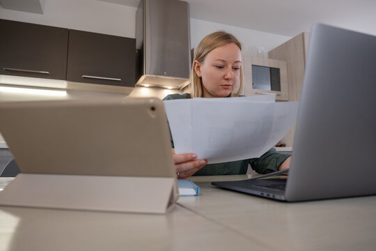 Female architect working on project at home