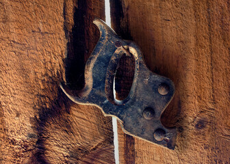 Old saw handle hangs on a nail in our shed for the past 20 years in Windsor in Upstate NY.  