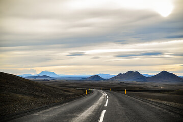 A distant view of Herðubreið volcano and the smoke column of the Holuhraun eruption from the Ring Road between the East Fjords and Mývatn, near Möðrudalur, Central Highlands, Iceland