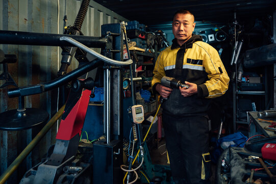 Portrait of asian car mechanic
