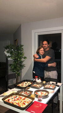UGC Senior mother and son with homemade pizza
