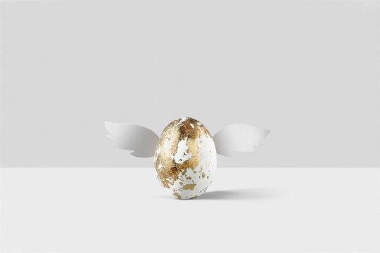 Golden Easter egg with wings.