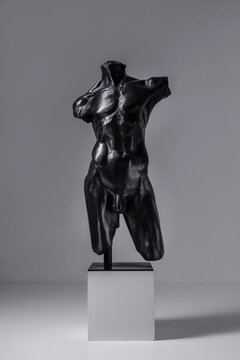 Human sculpture on grey background