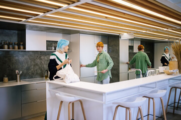 Girls doing their home chores at home together