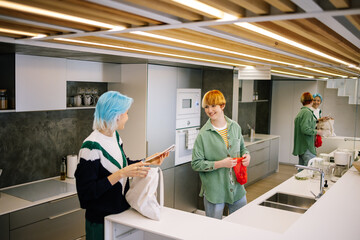 Girls taking ingredients from bags