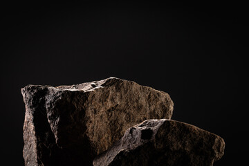 Natural stone background podium on dark background
