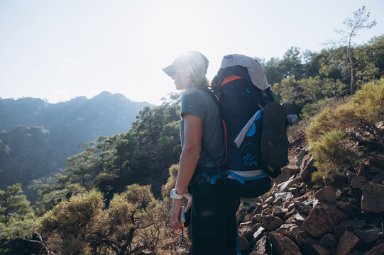 Traveling woman with backpack in highlands