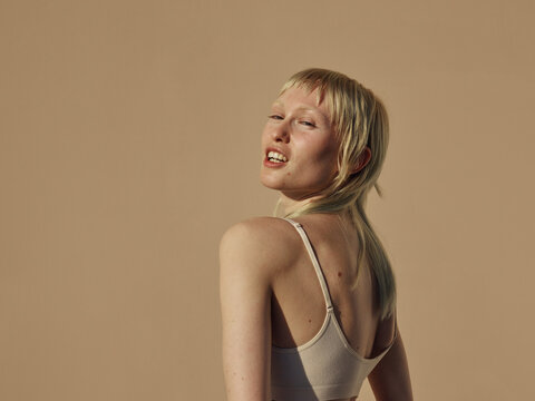 Self assured model portrait with bright sunlight 