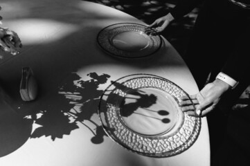 waiter serves table for outdoor festive dinner