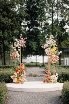wedding arch with fresh flowers on natural background