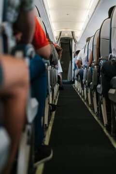 Passengers in cabin of airplane