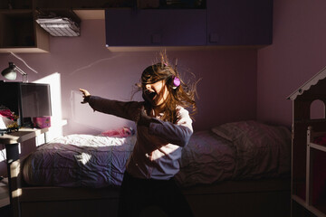 Happy girl singing and dancing