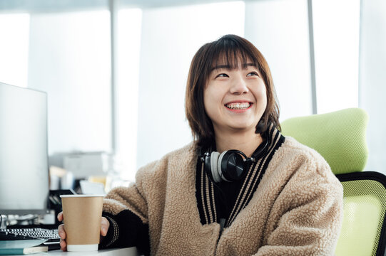 Young business woman smiling in office