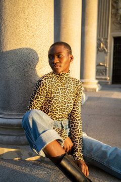 Portrait Of A Shorthaired Black Woman With Leopard Patterned Shirt. 