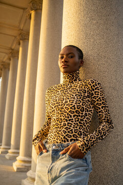 Portrait Of A Shorthaired Black Woman With Leopard Patterned Shirt. 