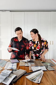 Two People Looking At Design Options