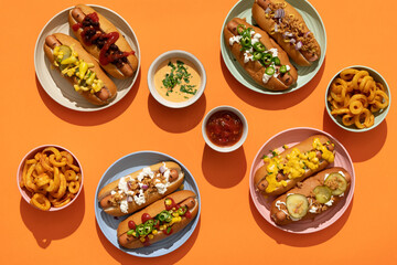 Finger food: grilled hot dogs with condiments and toppings