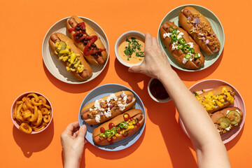 Finger food: grilled hot dogs with condiments and toppings