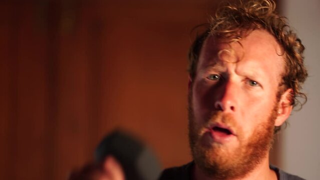 Working out at home, doing a home workout with weights, punching towards camera