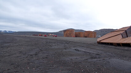 Old, rusted whale oil tanks and industrial equipment from the whaling era on the beach at Whaler's...