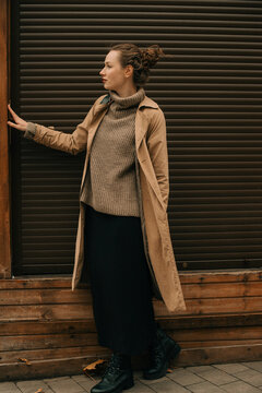 Woman at the wall looking away