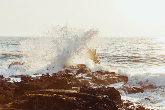 White waves and sunset on the coast.
