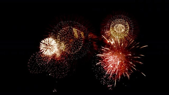 Colorful Firework Displays lighting up the sky at night in Slow Motion