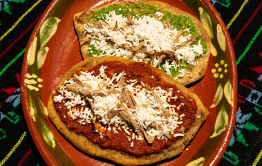 Gastronomic icons in Mexico known as Tlacoyos with green and red sauce